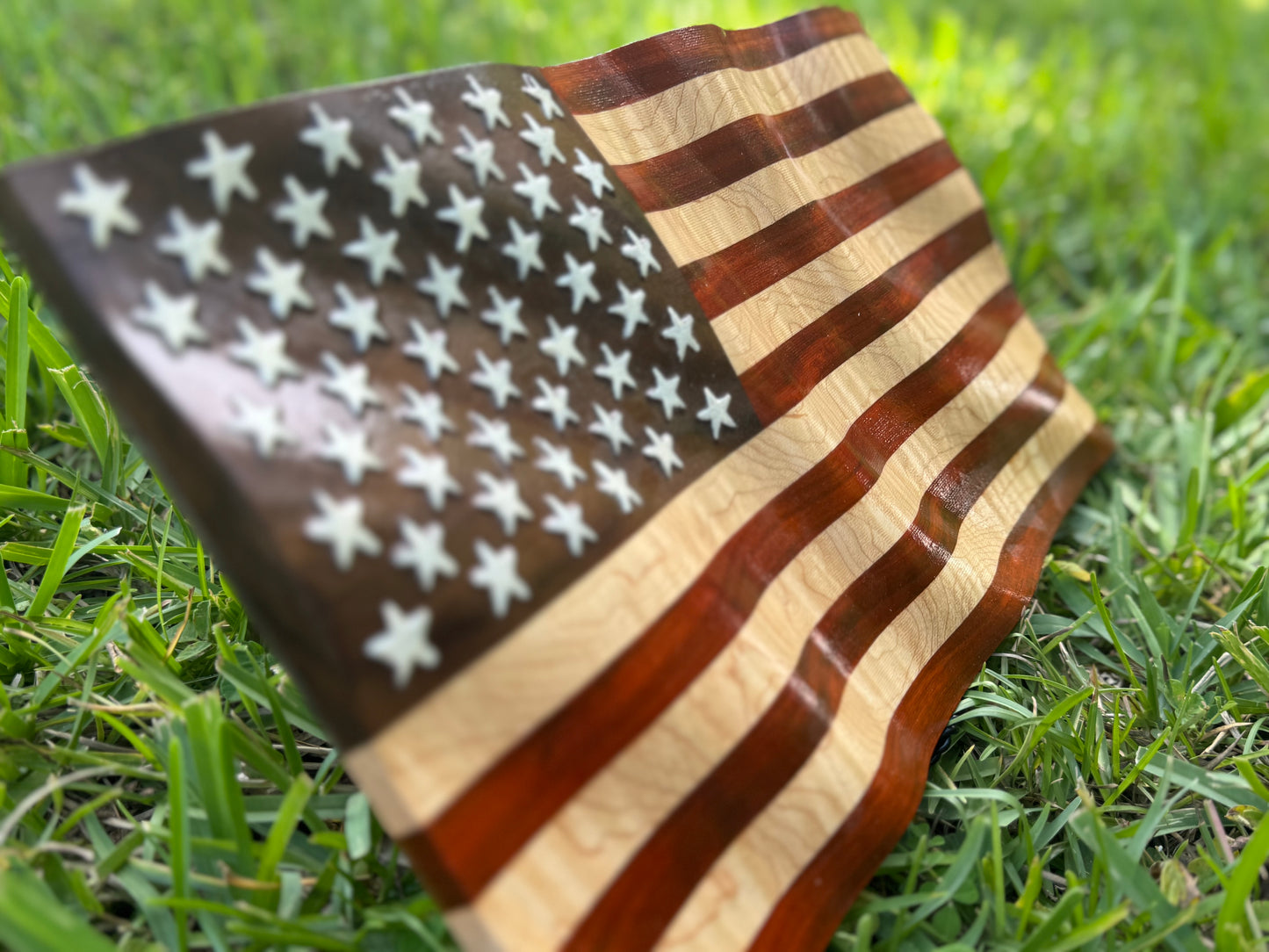 Wooden Wavy Flag made from Walnut, Paduka, and Curly Maple